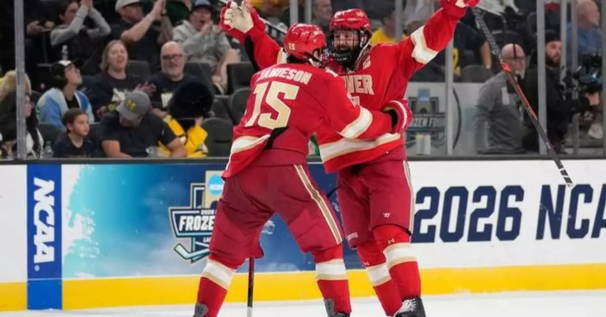 Kent Anderson’s 2-OT winner lifts Denver past Michigan 4-3 in Frozen Four thriller