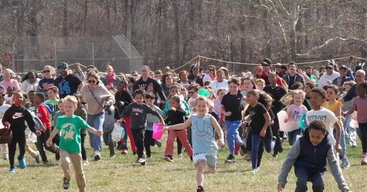 Children race to gather marshmallows dropped from a helicopter at pair of Michigan parks