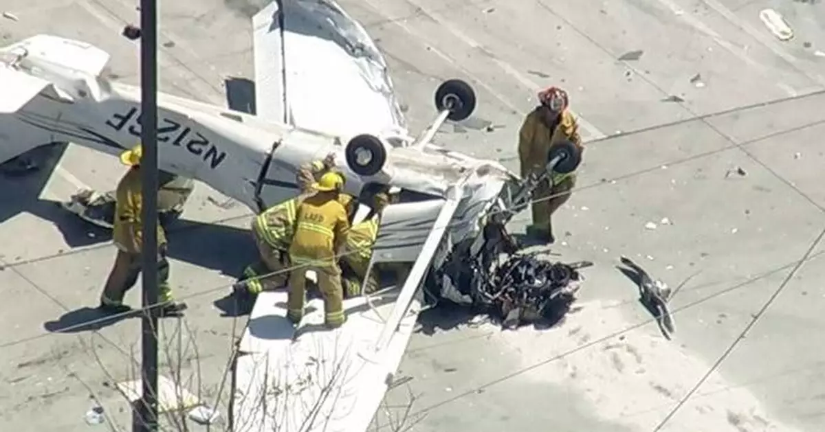 Small plane crashes in parking lot of Los Angeles auto store