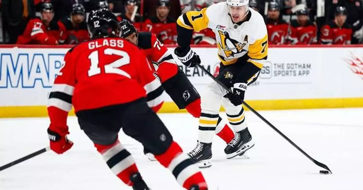 Malkin, Crosby and Letang help the Penguins beat the Devils to clinch a playoff spot