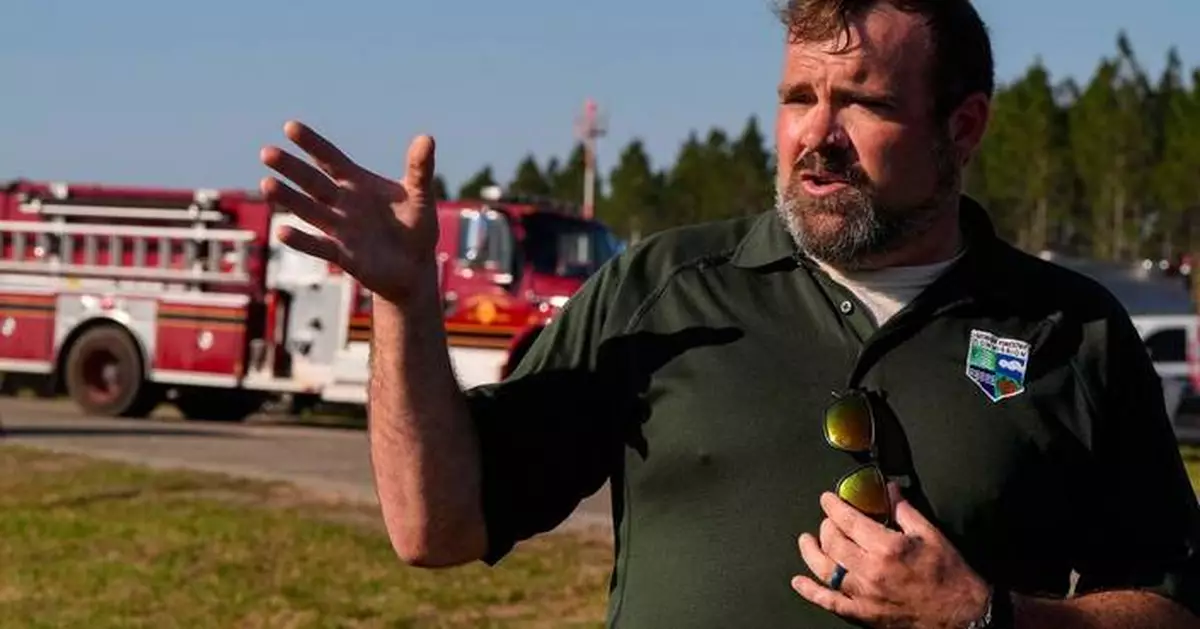 Southern US wildfires force residents to flee, leaving them unsure if their homes are standing