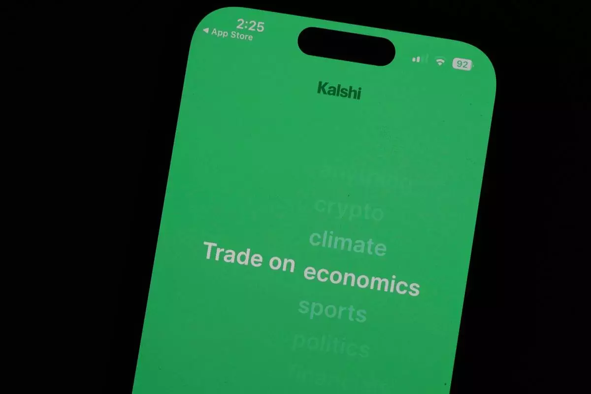 FILE - The prediction market app Kalshi is displayed on a mobile phone, April 16, 2026, in Chicago. (AP Photo/Erin Hooley, File)