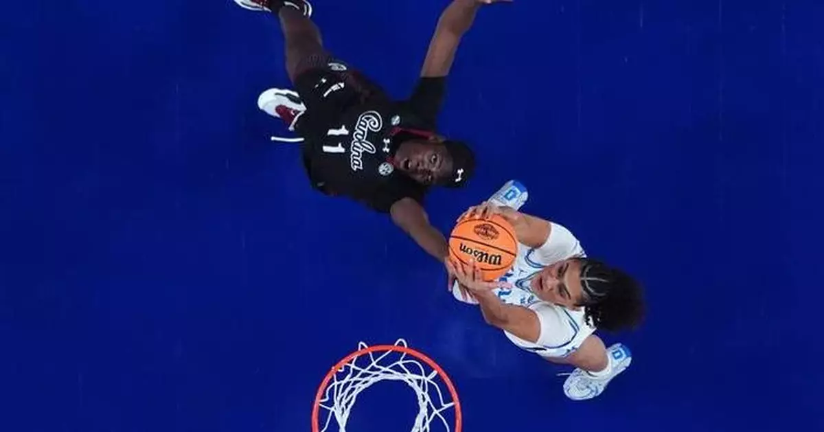 Staley embraces UCLA's Close ahead of title game, then smirks to the crowd after handshake drama