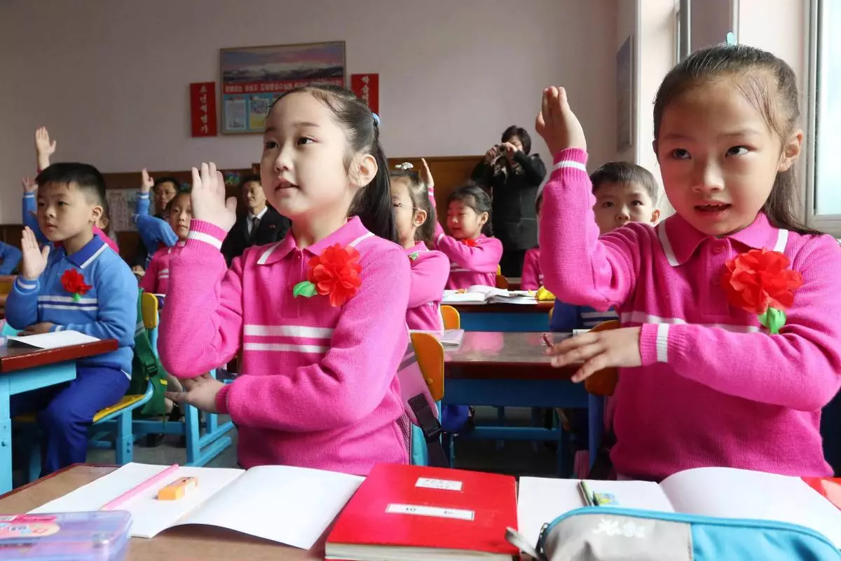 Newly enrolled pupils have their first lesson as a school-opening ceremony took place at Kim Song Ju Primary School in Pyongyang, North Korea Wednesday, April 1, 2026. (AP Photo/Jon Chol Jin)