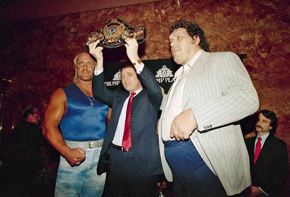 FILE - Real estate developer Donald Trump holds the World Wrestling Federation Championship belt flanked by Hulk Hogan, left, and Andre the Giant at a news conference, March 15, 1988, in New York. (AP Photo/Susan Ragan, File)