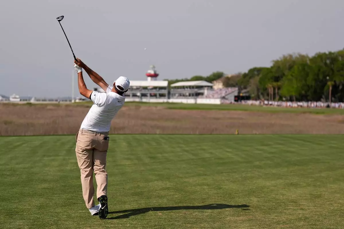Scottie Scheffler hits from the 18th tee during the third round of the RBC Heritage golf tournament Saturday, April 18, 2026, in Hilton Head, S.C. (AP Photo/Mike Stewart)