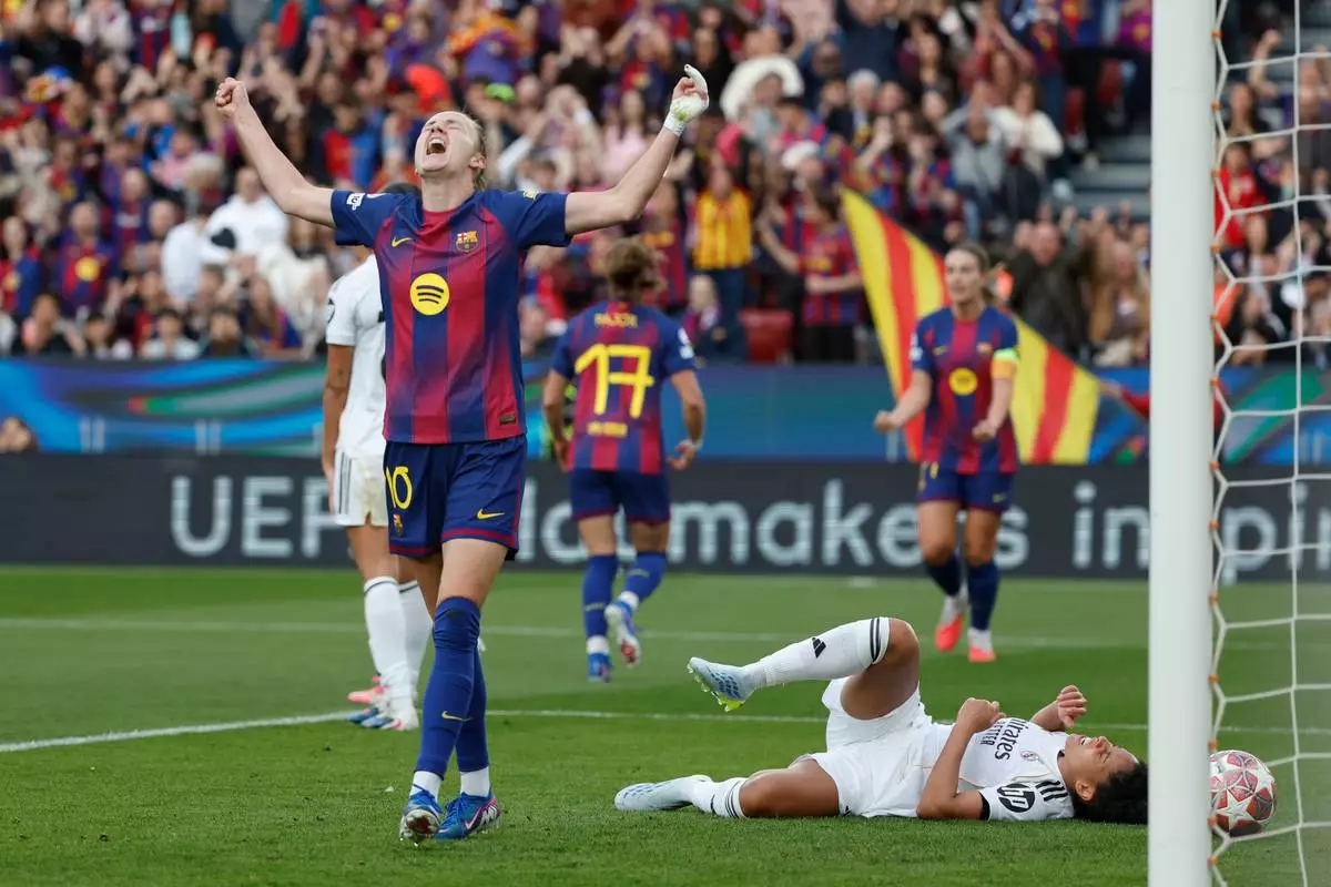 Barcelona's Graham Hansen celebrates after scoring her side's second goal during a Champions League quarterfinal soccer match between Barcelona and Real Madrid, in Barcelona, Spain, Thursday, April 2 2026. (AP Photo/Joan Monfort)