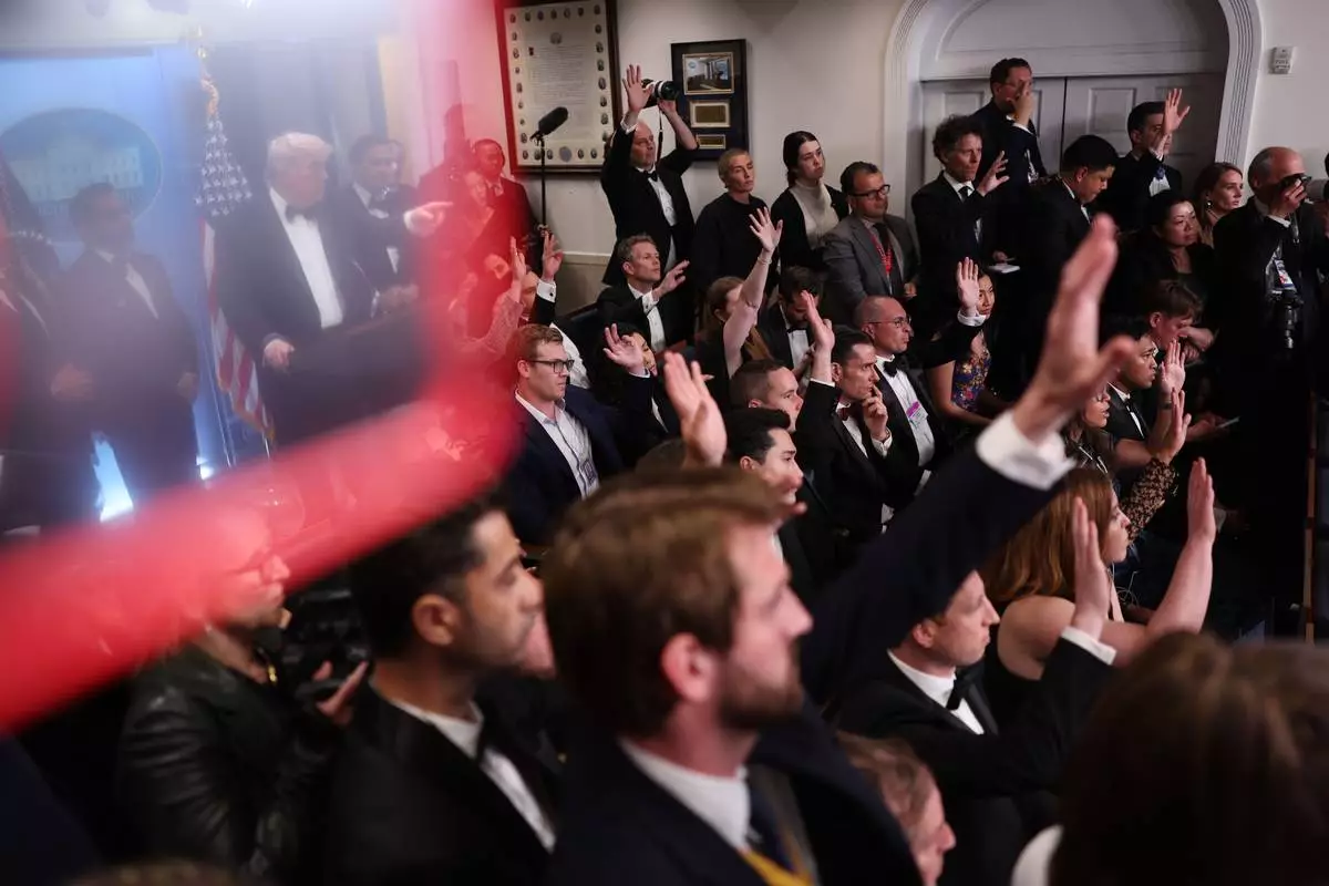 President Donald Trump answers reporter questions in the James Brady Press Briefing Room at the White House after an unspecified threat at the annual White House Correspondents' Association Dinner in Washington, Saturday, April 25, 2026. (AP Photo/Tom Brenner)