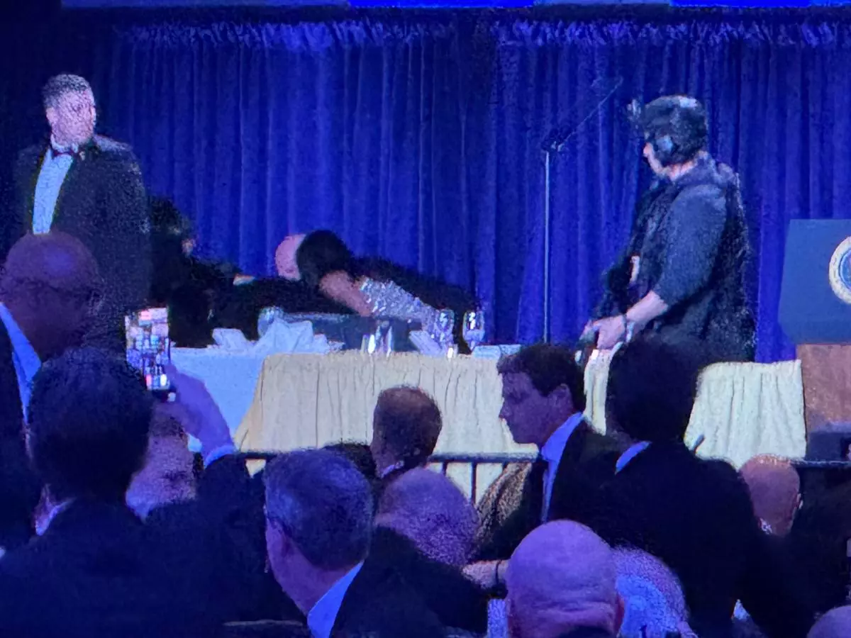 Secret service agents respond during the White House Correspondents Dinner, Saturday, April 25, 2026, in Washington. (AP Photo/Mark Schiefelbein)