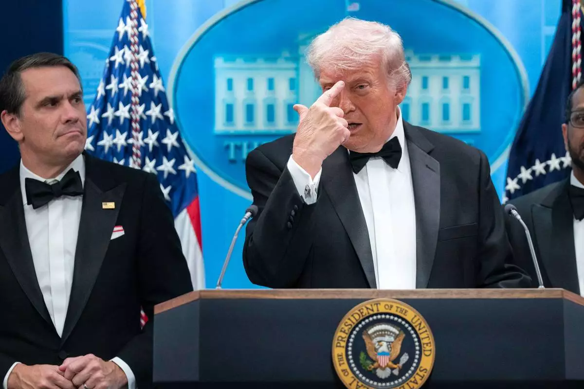 President Donald Trump gestures as he speaks in the James Brady Press Briefing Room at the White House after a shooting incident outside the ballroom at at the annual White House Correspondents' Association dinner in Washington, Saturday, April 25, 2026. (AP Photo/Jose Luis Magana)