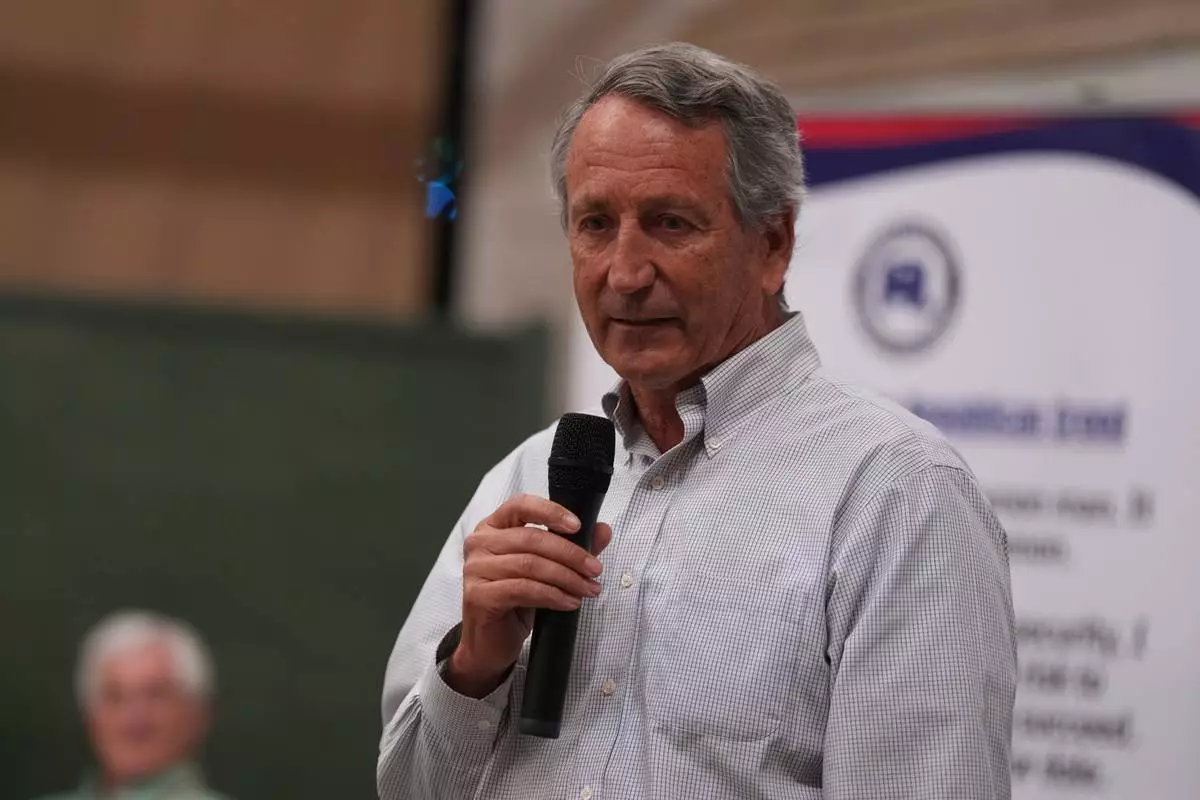 Mark Sanford, former congressman and South Carolina governor, speaks to voters he campaigns for his former U.S. House seat at a Dorchester County GOP event Thursday, April 9, 2026, in Summerville, S.C. (AP Photo/Meg Kinnard)