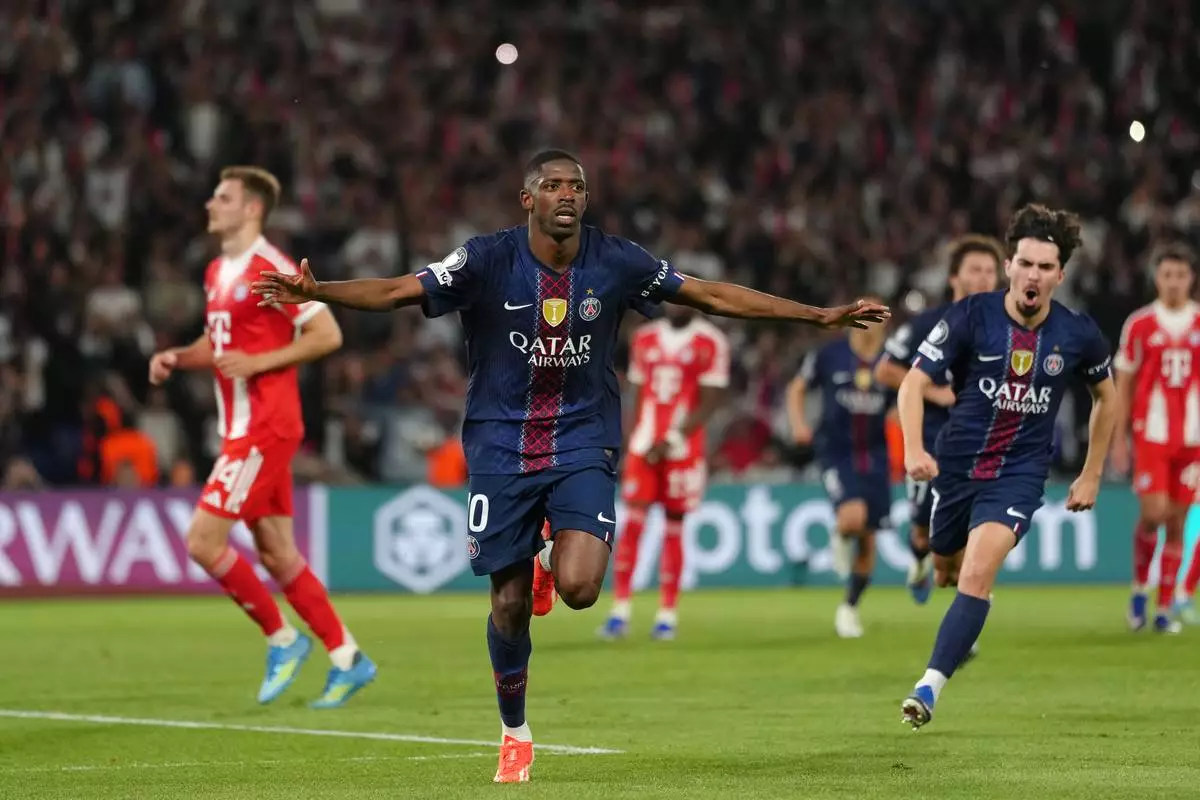 PSG's Ousmane Dembele celebrates after scoring his side's third goal during a Champions League semifinal, first leg, soccer match between Paris Saint-Germain and Bayern Munich in Paris, Tuesday, April 28, 2026. (AP Photo/Aurelien Morissard)