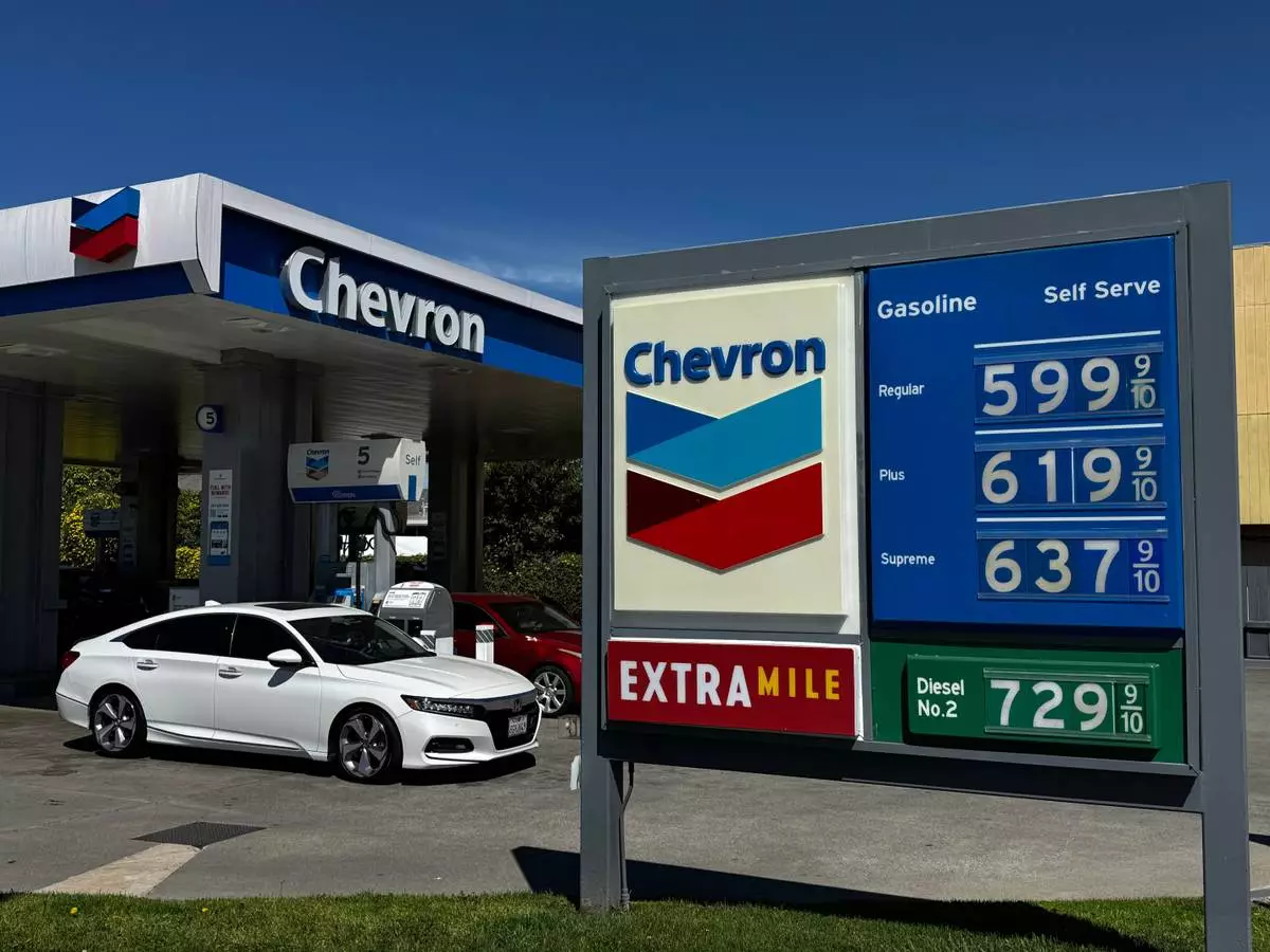 A Chevron gas station in Alameda, Calif. displays gas prices on March 23, 2026. (AP Photo/Terry Chea)