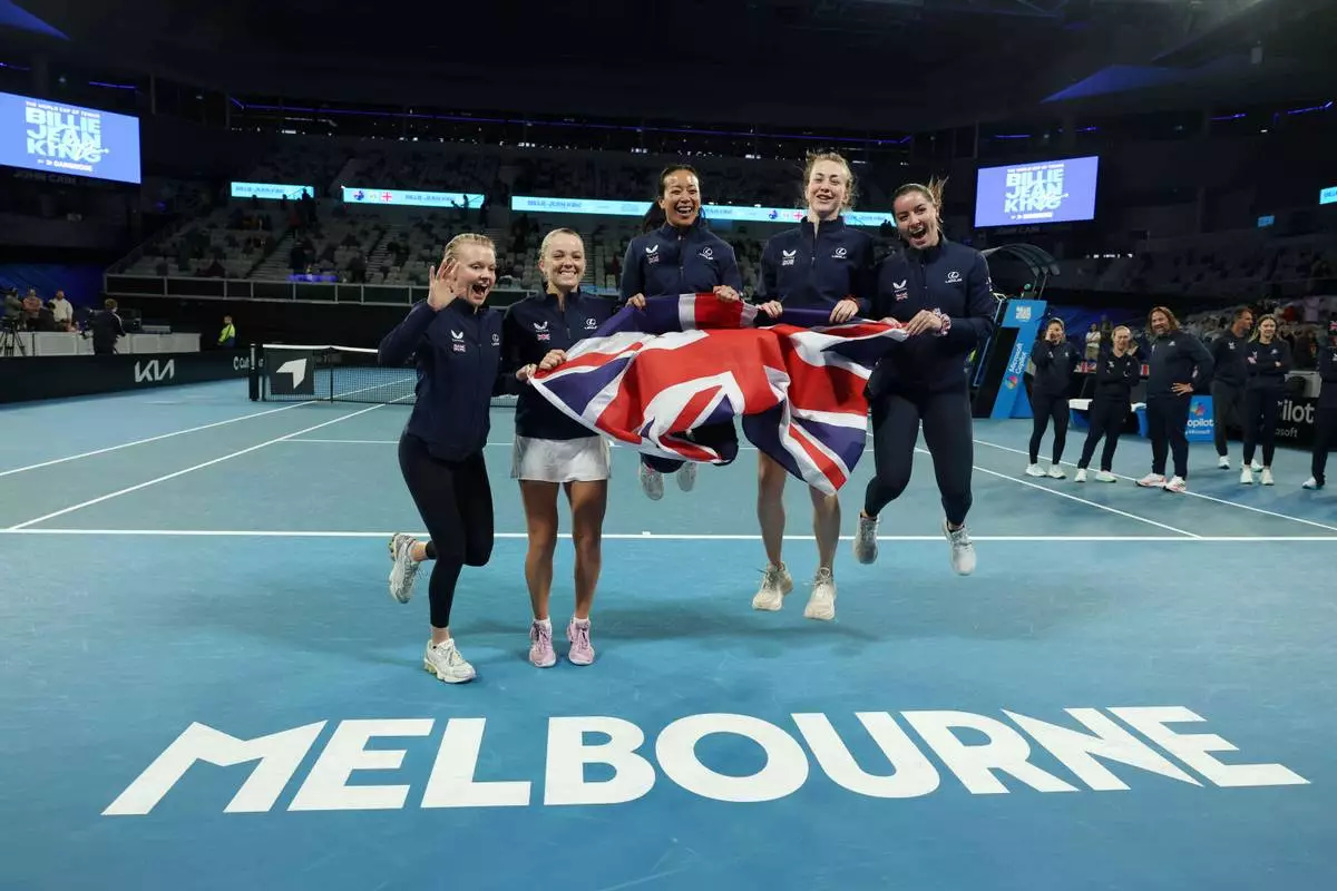 British Billy Jean Cup tennis players Harriet Dart, Katie Swan, Anne Keothavong, Mika Stojsavljevic and Jodie Anna Burrage celebrate, Saturday, April 11, 2026, after defeating Australia in Melbourne, Saturday, April 11, 2026. (Con Chronis/AAP Image via AP)