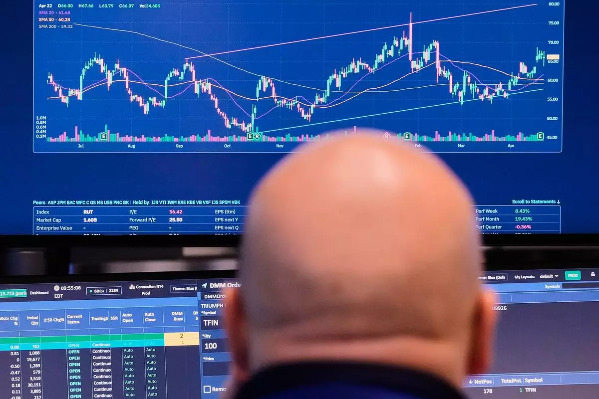 Specialist John Parisi works at his post on the floor of the New York Stock Exchange, Wednesday, April 22, 2026. (AP Photo/Richard Drew)