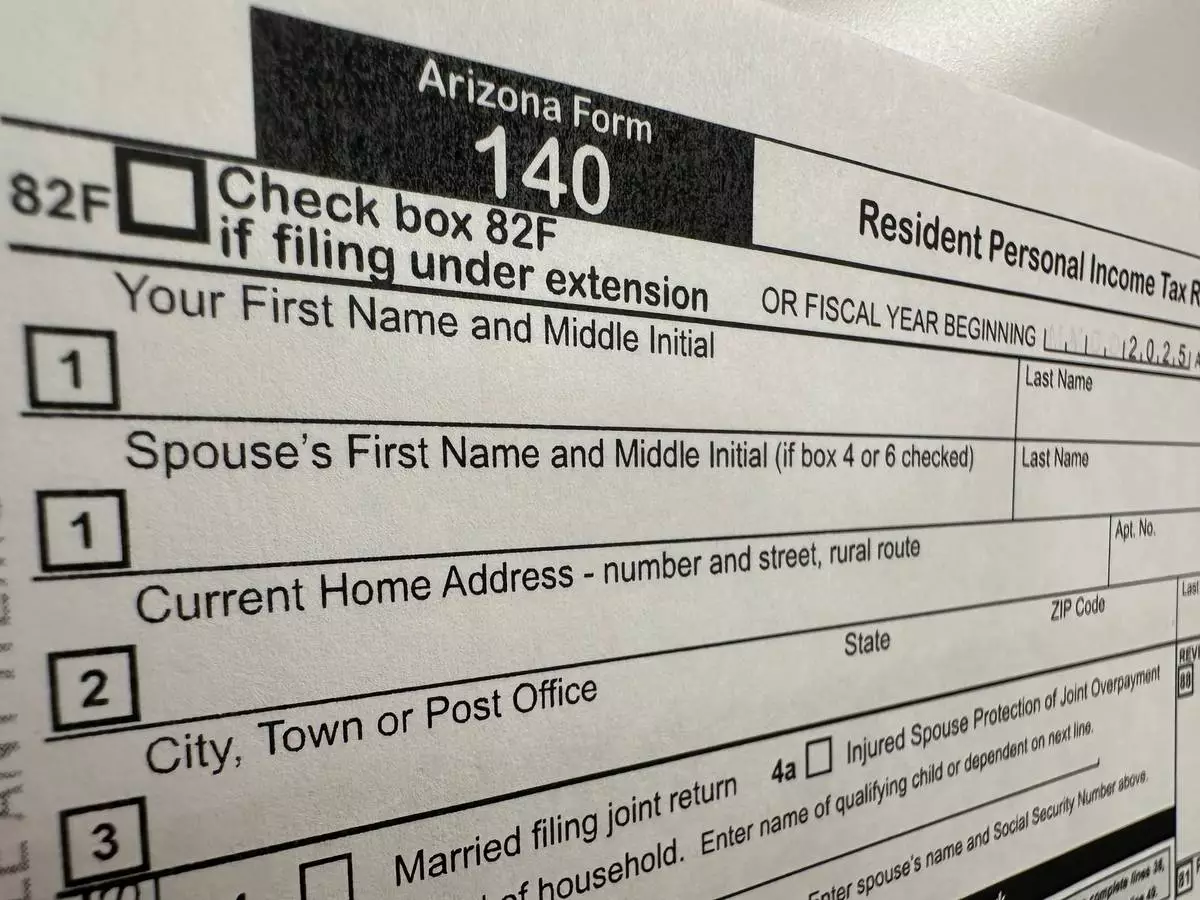 An Arizona state personal income tax form is shown Tuesday, April 7, 2026, in Jefferson City, Mo. (AP Photo/David A. Lieb)
