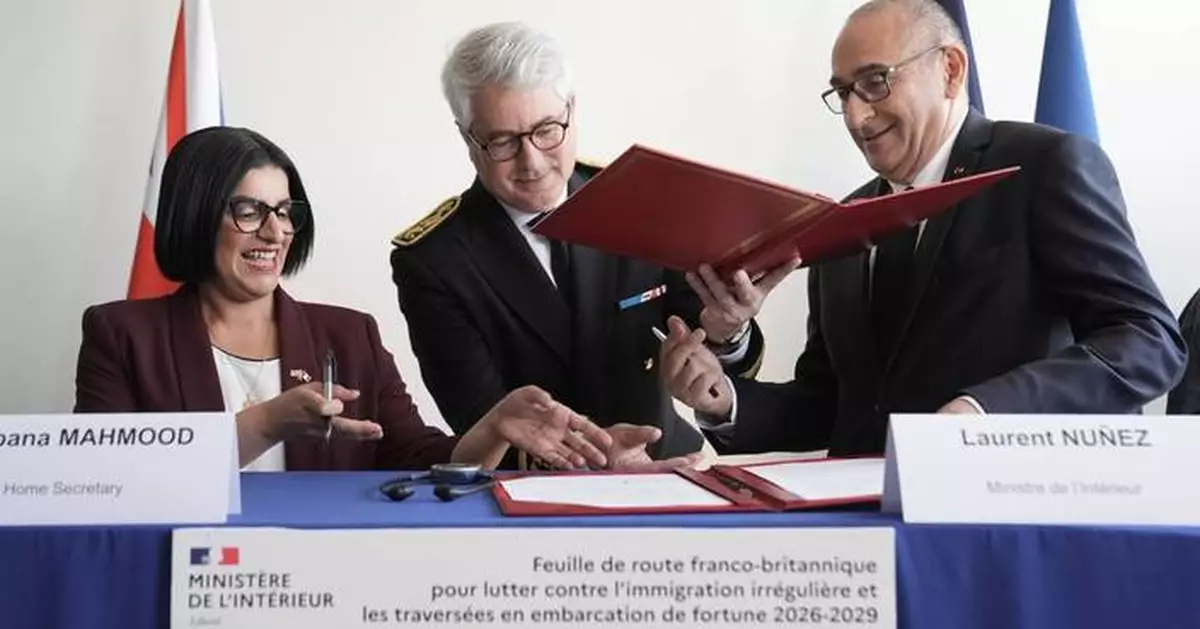 UK and French governments sign a 3-year deal to curb migrant crossings in English Channel
