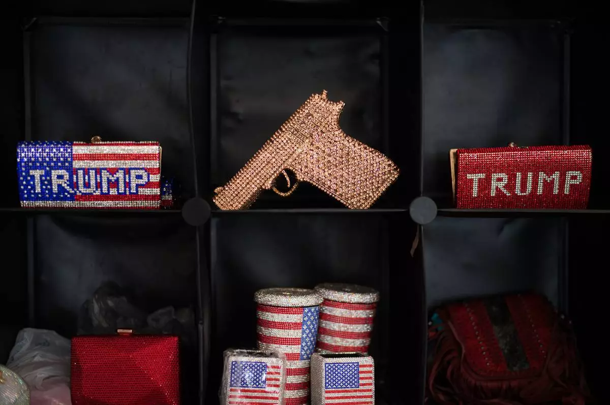 FILE - US flag symbol merchandise and other rhinestone-studded items are displayed at the California Republican Party Convention in San Diego, Saturday, April 11, 2026. (AP Photo/Jae C. Hong, File)