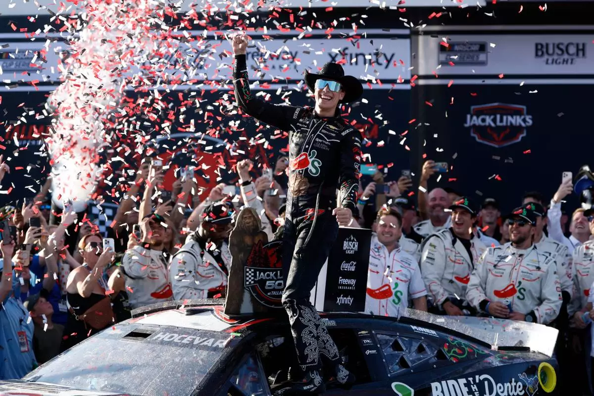 Carson Hocevar celebrates after winning a NASCAR Cup Series auto race, Sunday, April 26, 2026, in Talladega, Ala. (AP Photo/Butch Dill)