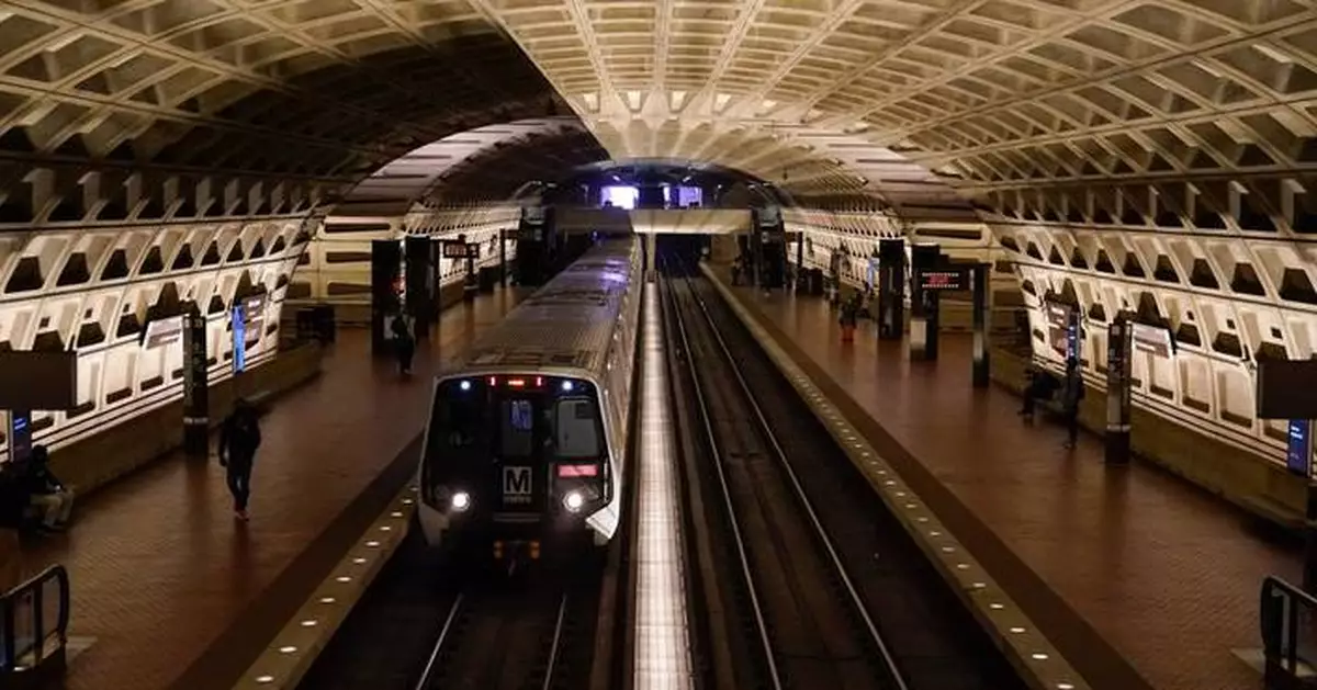 A work vehicle hits a stopped Washington Metro train, injuring 11