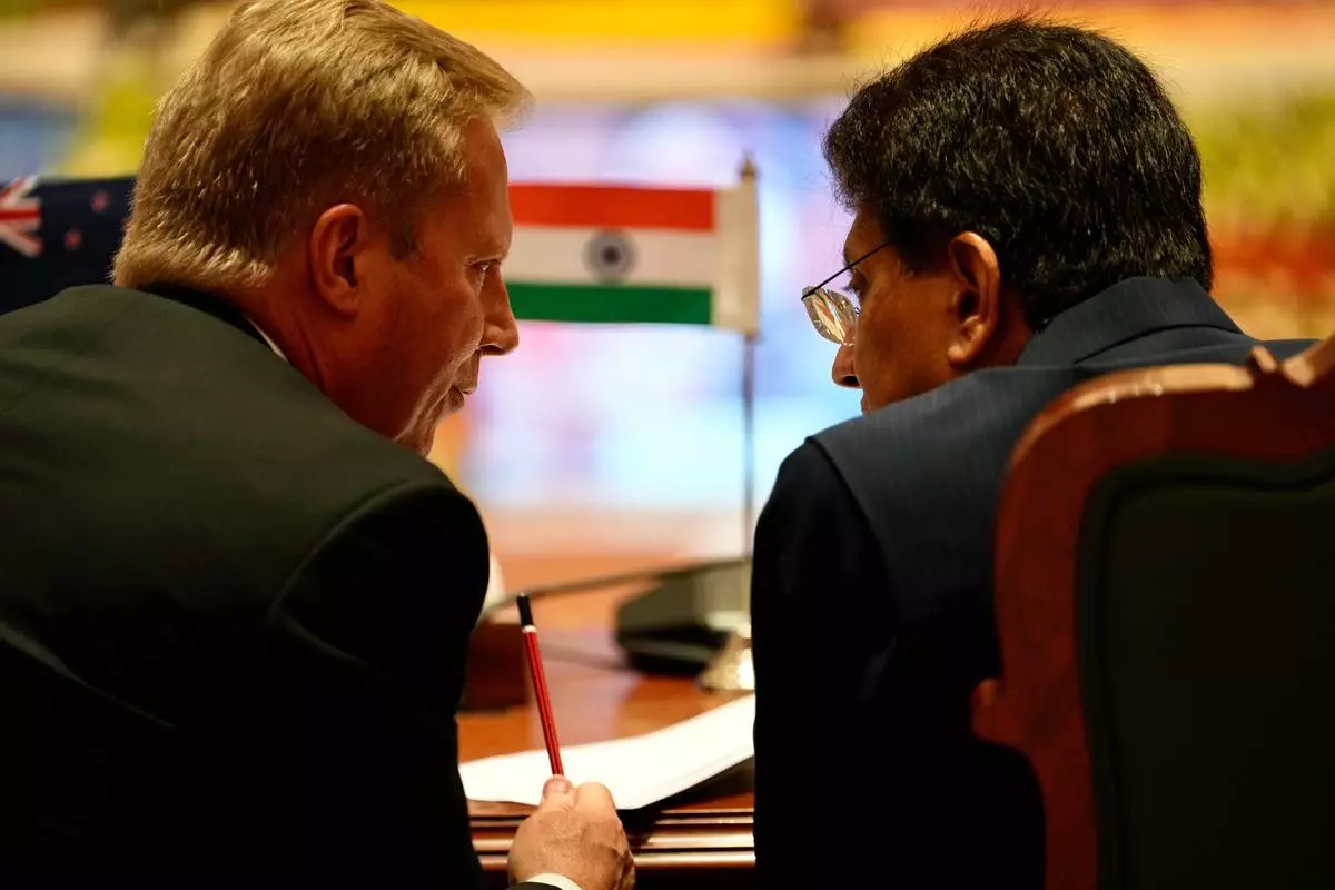 New Zealand Trade Minister Todd McClay, left, talks with Indian Commerce Minister Piyush Goyal during the India New Zealand Free Trade Agreement signing ceremony and Business forum meeting in New Delhi, India, Monday, April 27, 2026. ( AP Photo/Manish Swarup)
