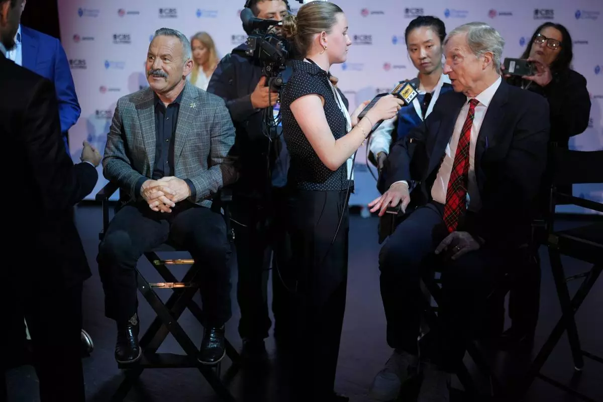 Chad Bianco, left, and Tom Steyer speak with members of the media following a California gubernatorial debate hosted by CBS LA at Pomona College in Claremont, Calif., Tuesday, April 28, 2026. (AP Photo/Jae C. Hong)
