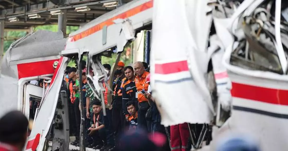 Rescuers recover victims from an Indonesia train crash, in photos