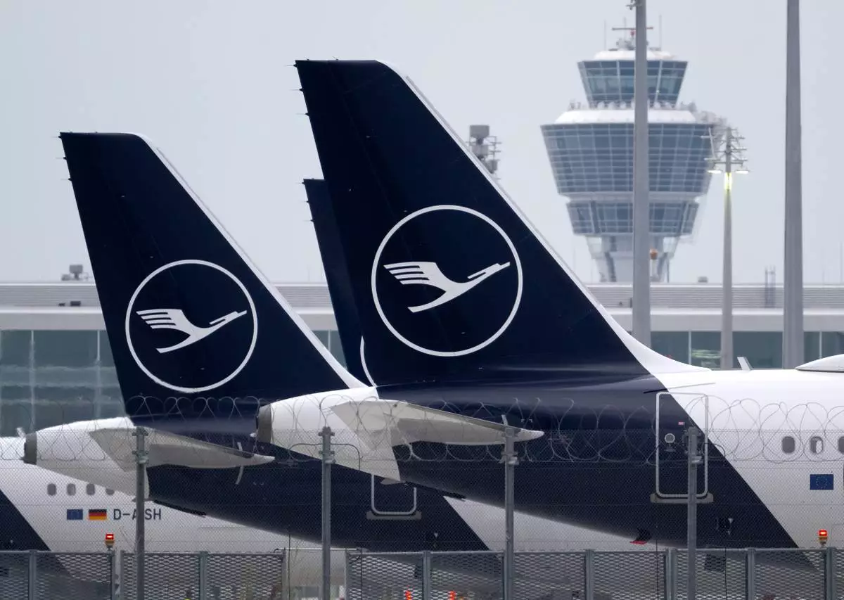 FILE - Lufthansa aircraft are parked on the apron at Munich Airport, in Munich, Germany, Friday, April 10, 2026. (Sven Hoppe/dpa via AP, File)