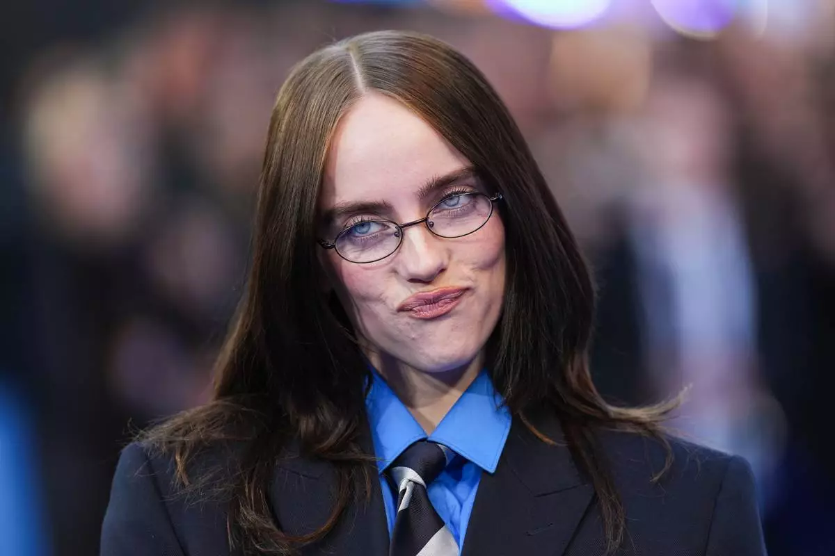 Billie Eilish poses for photographers upon arrival at the screening of the film 'Hit Me Hard and Soft: The Tour' on Tuesday, April 28, 2026, in London. (Photo by Scott A Garfitt/Invision/AP)