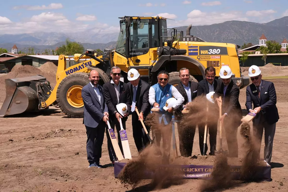 Officials break ground for the new Knight Riders Cricket Field, which will serve as the Los Angeles Knight Riders' official home field for 2026 and later host cricket at the LA 2028 Olympics, at the Pomona Fairplex in Pomona, Calif., on Wednesday, April 22, 2026. (AP Photo/Damian Dovarganes)