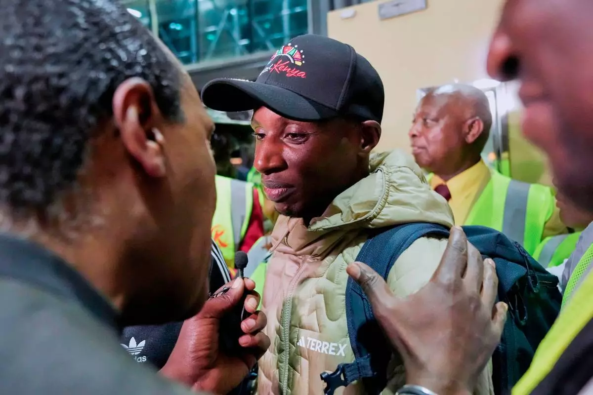 Sabastian Sawe is welcomed after arriving on a flight from London, Wednesday, April 29, 2026, at Jomo Kenyatta International Airport in Nairobi, Kenya, after setting a new world record in the marathon. (AP Photo/Brian Inganga) CORRECTION: Corrects spelling of first name to Sabastian, not Sebastian