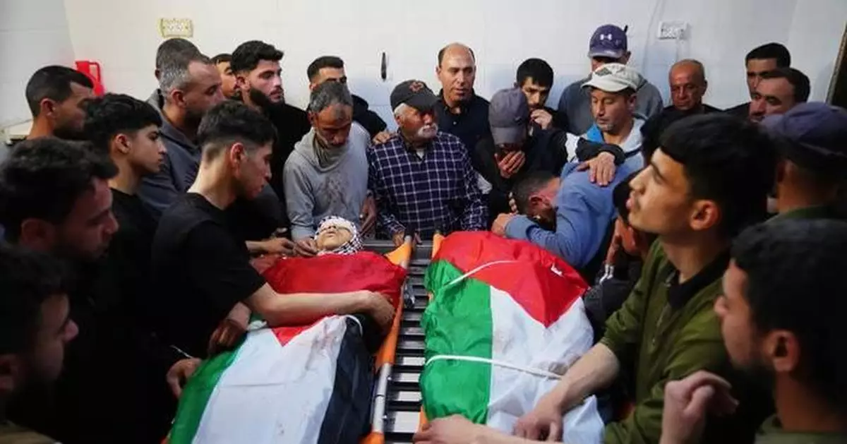 Israeli army reservist kills 2 Palestinians, including a 14-year-old, in the occupied West Bank