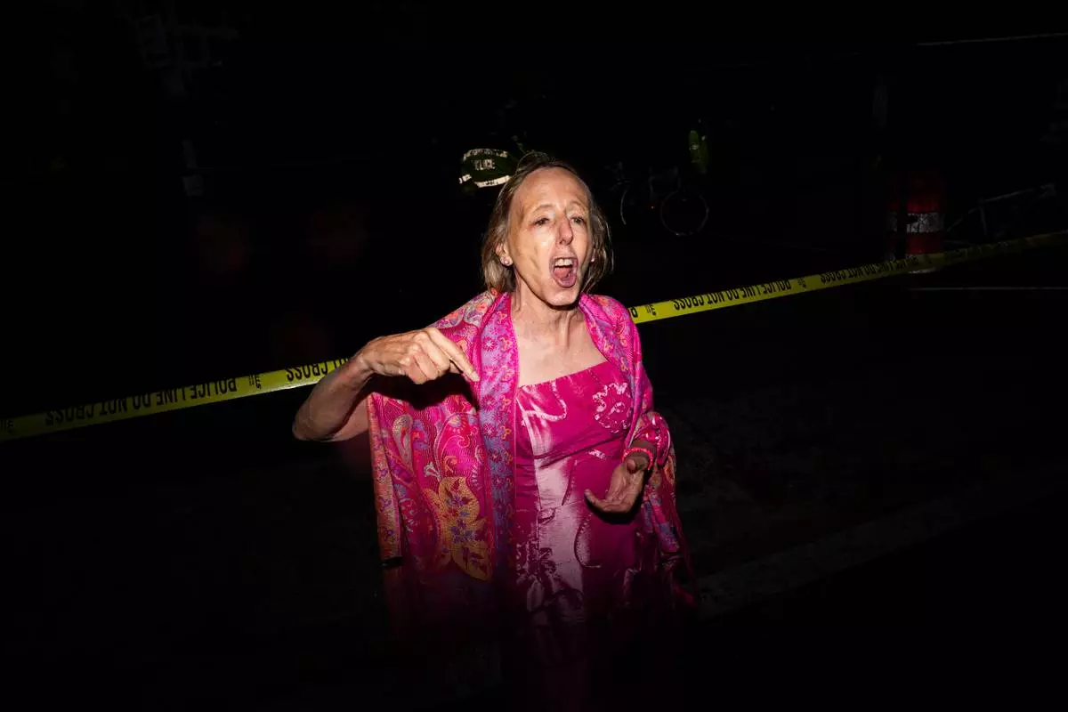 Code Pink co-founder Medea Benjamin speaks to the media after being removed from the White House Correspondents Dinner, Saturday, April 25, 2026, in Washington. (AP Photo/Allison Robbert)