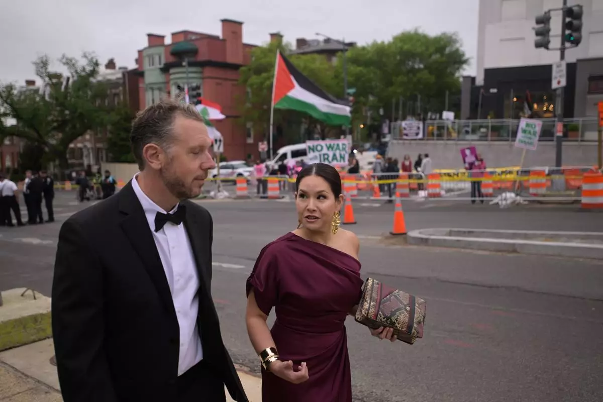 People are seen outside of the White House Correspondents Dinner, Saturday, April 25, 2026, in Washington. (AP Photo/Rod Lamkey, Jr.)
