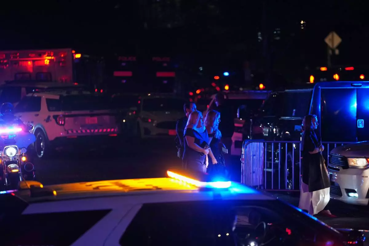 Guests leave the White House Correspondents Dinner following an incident Saturday, April 25, 2026, in Washington. (AP Photo/Allison Robbert)