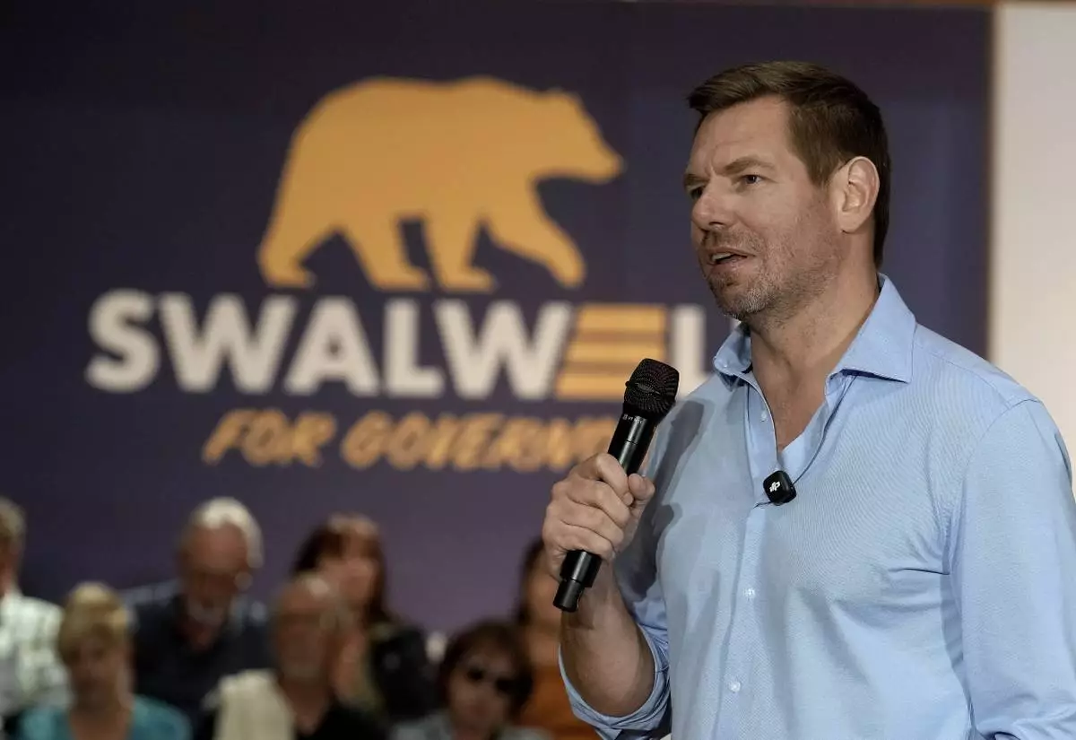California gubernatorial candidate, Rep. Eric Swalwell, D-CA appears at a town hall meeting in Sacramento, Calif., Tuesday, April 7, 2026. (AP Photo/Rich Pedroncelli)