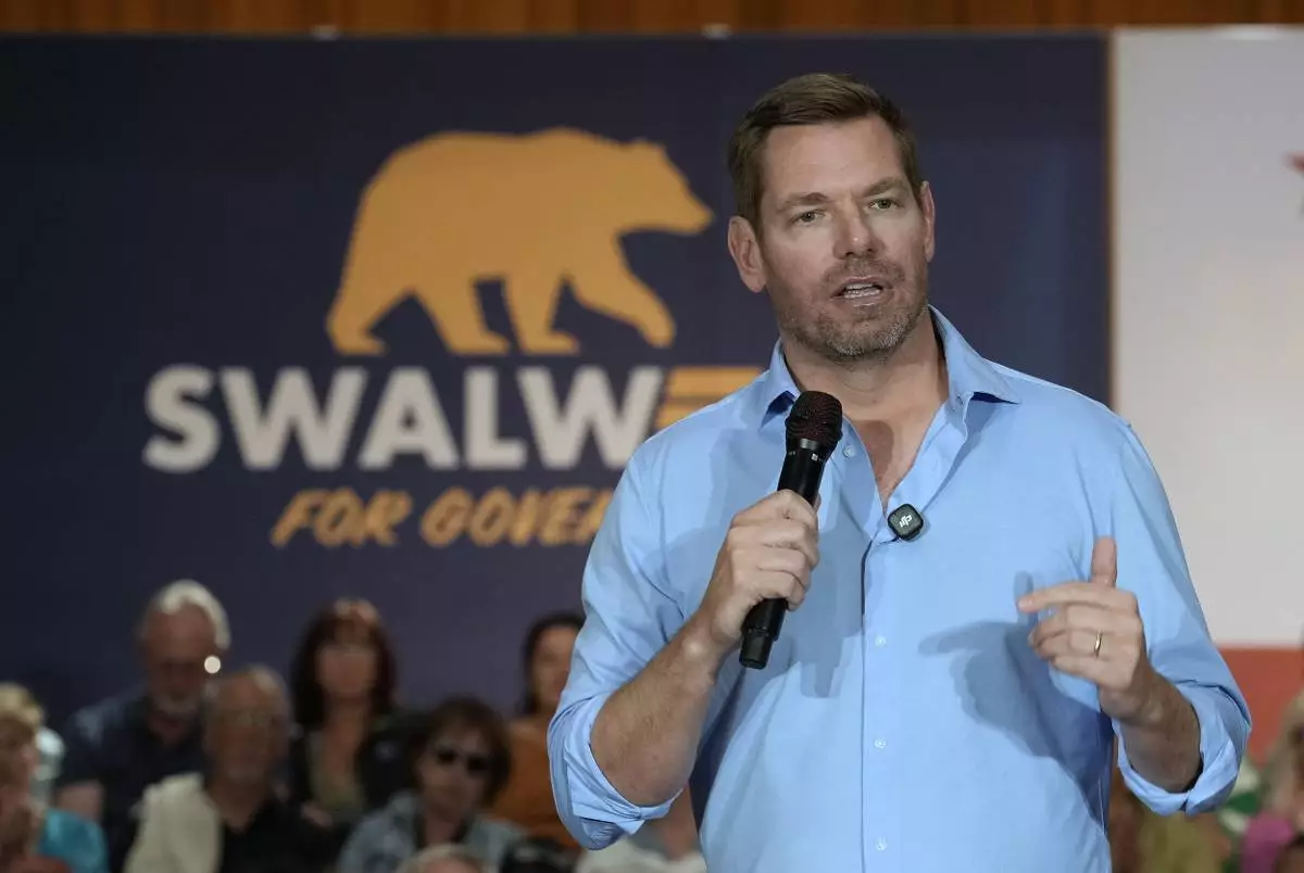 California gubernatorial candidate, Rep. Eric Swalwell, D-CA appears at a town hall meeting in Sacramento, Calif., Tuesday, April 7, 2026. (AP Photo/Rich Pedroncelli)