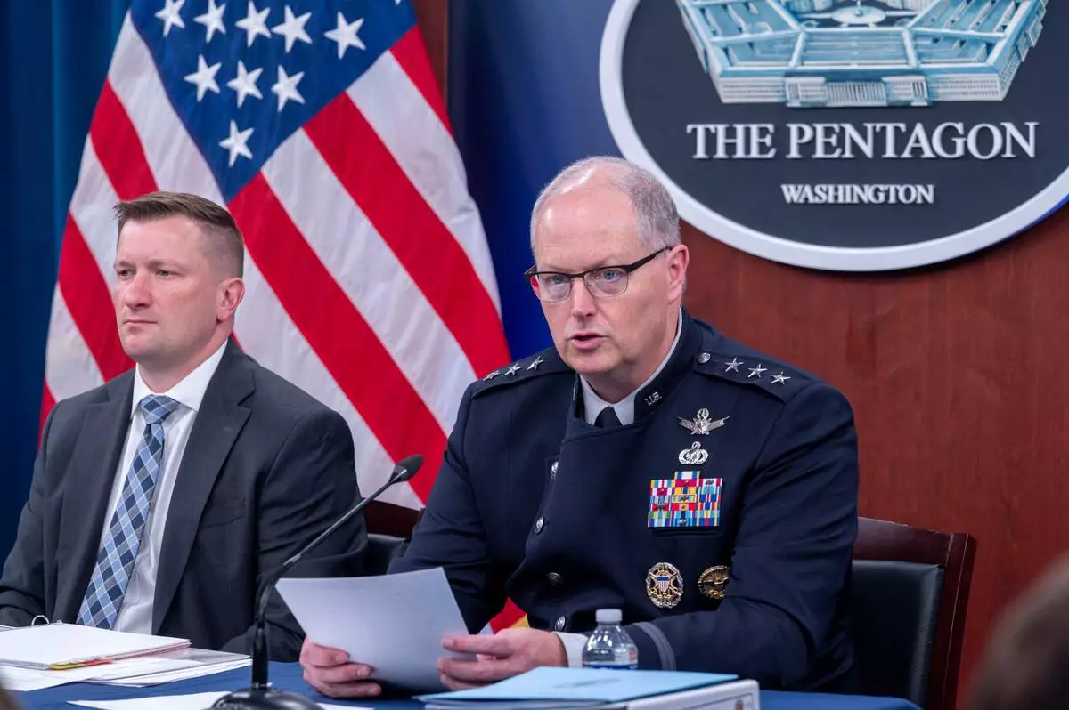 Director of Force Structure, Resources and Assessment of the Joint Chief of Staff Space Force Lt. Gen. Steven Whitney, right, and Acting Under Secretary of Defense and Comptroller, Jules Hurst III, talk with members of the media during a briefing on the Department of Defense's FY27 Budget Request at the Pentagon, Tuesday, April 21, 2026 in Washington. (AP Photo/Kevin Wolf)