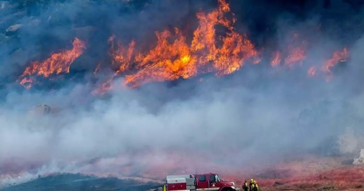 A fast-growing wildfire in windy Southern California triggers evacuations
