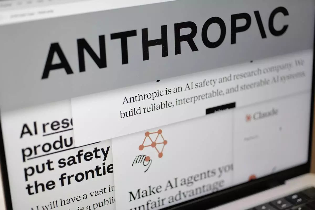 FILE - Pages from the Anthropic website and the company's logo are displayed on a computer screen in New York on Feb. 26, 2026. (AP Photo/Patrick Sison, File)