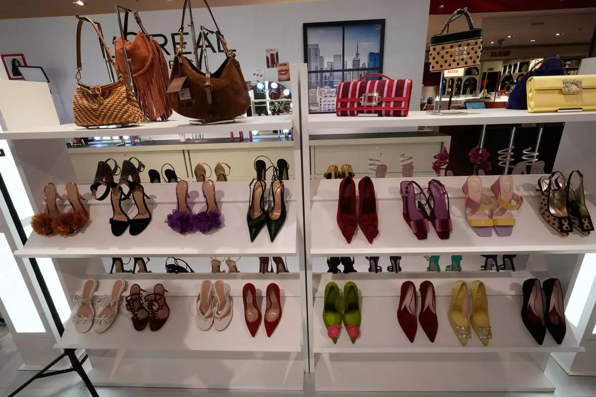 Women's shoes are seen part of an installation of the new movie 'Devil Wears Prada 2' at La Rinascente shopping center, in Milan, Italy, Monday, April 20, 2026. (AP Photo/Luca Bruno)