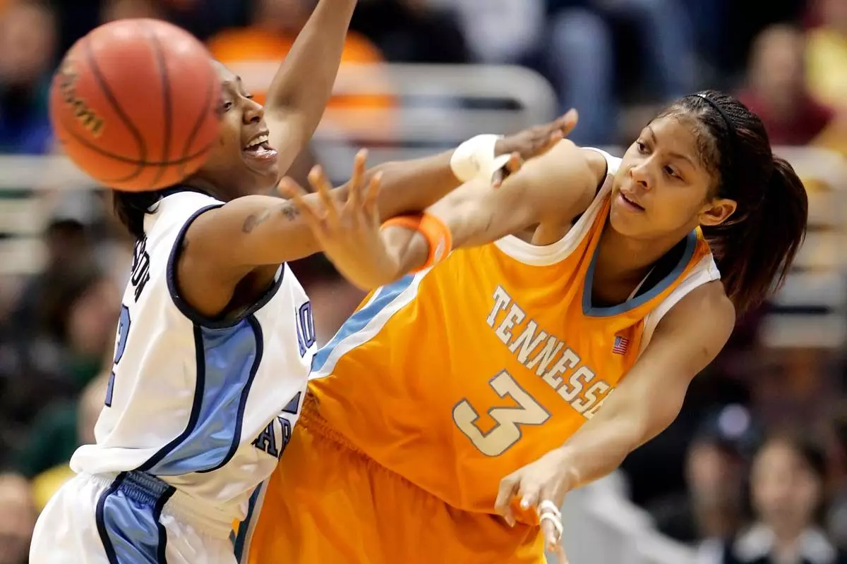 FILE - Tennessee's Candace Parker (3) passes around North Carolina's La'Tangela Atkinson in the first half of the NCAA college basketball tournament regional final, Tuesday, March 28, 2006, in Cleveland. (AP Photo/Amy Sancetta, File)