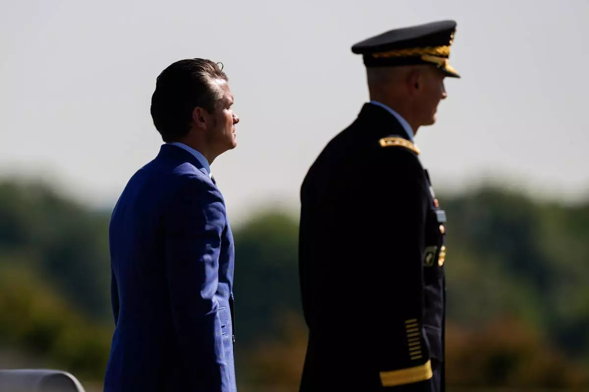 FILE - Defense Secretary Pete Hegseth, left, and Army Chief of Staff Gen. Randy George review troops during the POW/MIA National Recognition Day Ceremony at the Pentagon, Sept. 19, 2025, in Washington. (AP Photo/Julia Demaree Nikhinson, File)