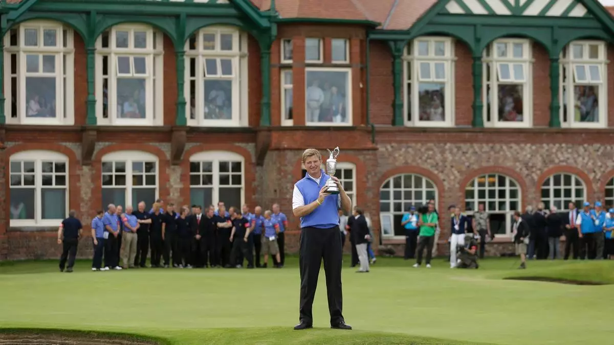 FILE - Ernie Els of South Africa holds the Claret Jug trophy after winning the British Open Golf Championship at Royal Lytham &amp; St Annes golf club, Lytham St Annes, England Sunday, July 22, 2012. (AP Photo/Jon Super, file)