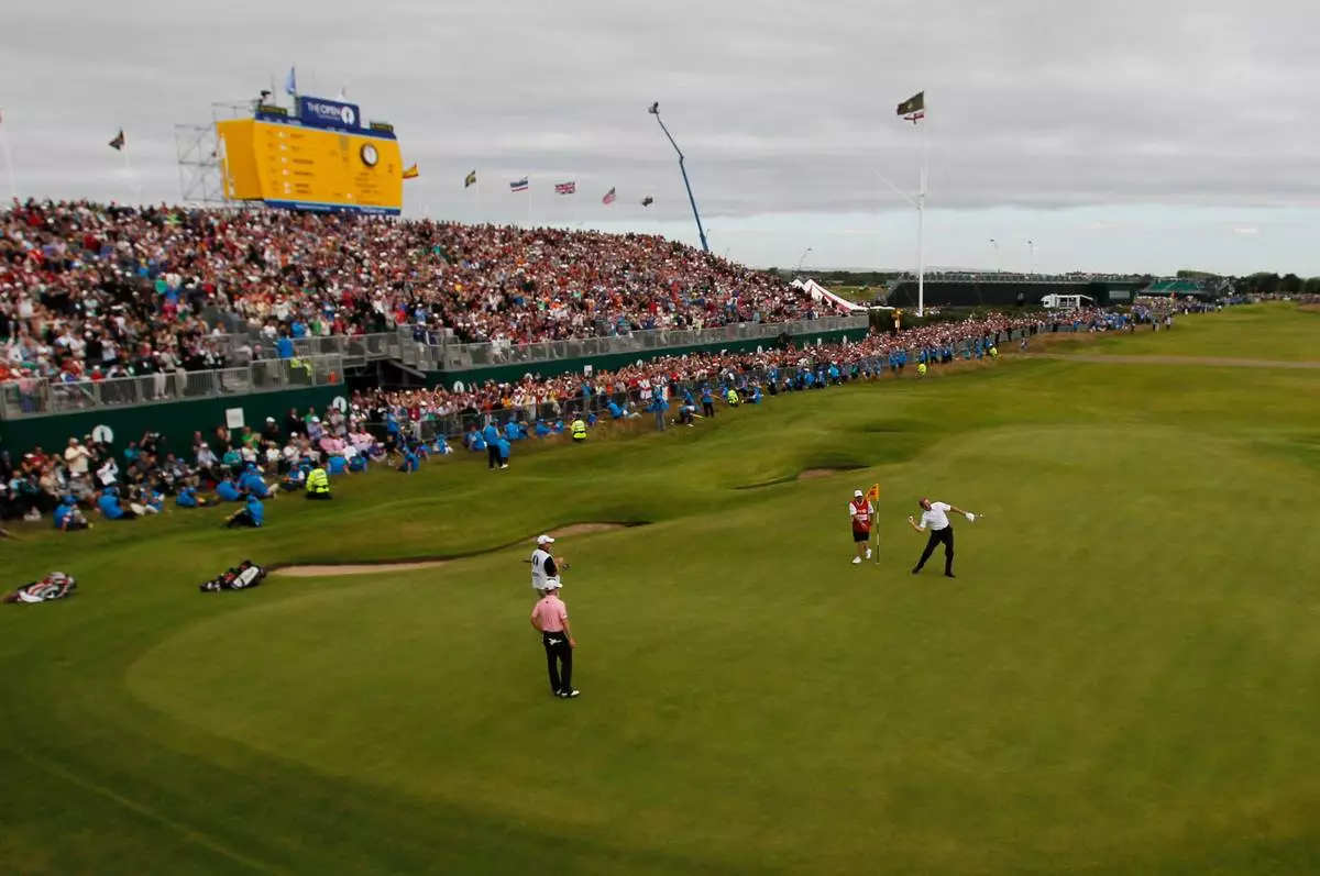 FILE - Ernie Els of South Africa reacts after putting on the 18th green with his caddie Ricky Roberts at Royal Lytham &amp; St Annes golf club during the final round of the British Open Golf Championship, Lytham St Annes, England Sunday, July 22, 2012. (AP Photo/Chris Carlson, file)