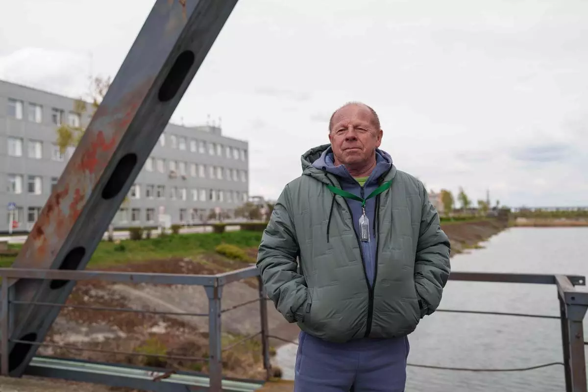Anatolii Prylipko, 66, who drove a fire truck near the Chernobyl nuclear power plant after the 1986 accident, poses for a portrait near the plant in Chernobyl, Ukraine, Tuesday, April 21, 2026. (AP Photo/Evgeniy Maloletka)