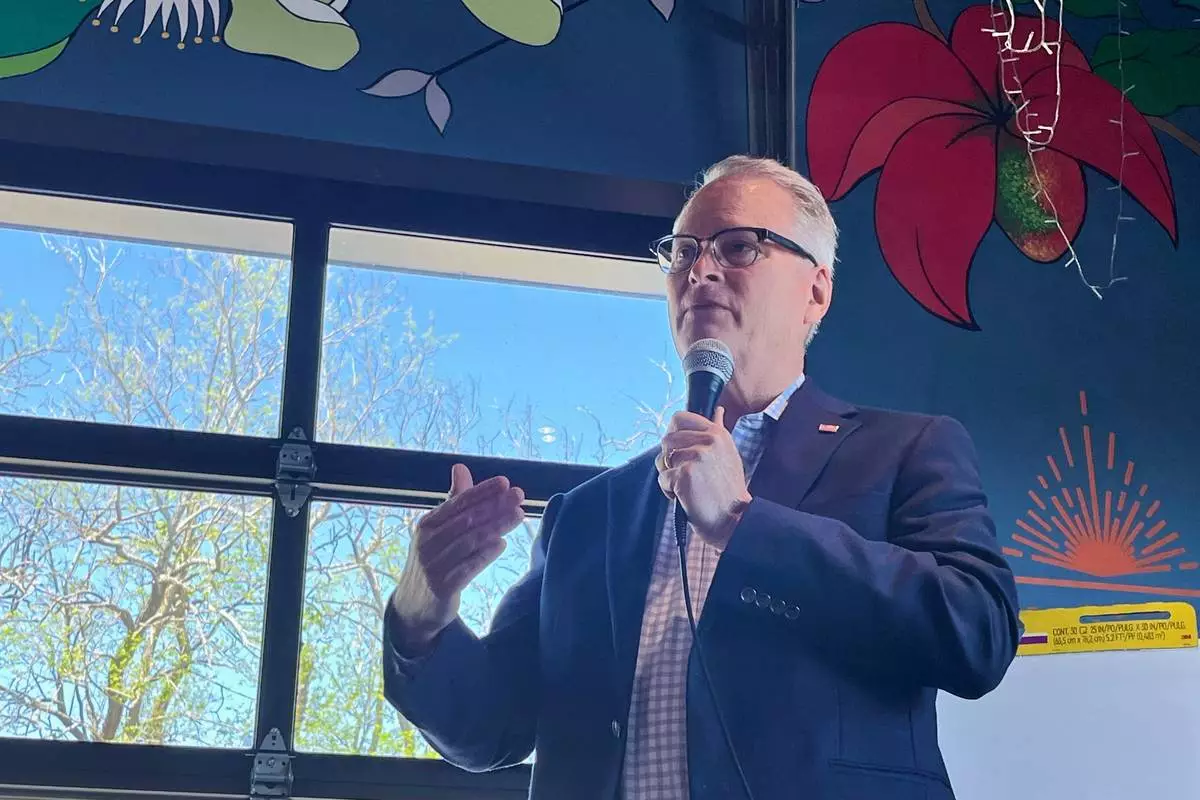 Adam Hamilton, a Methodist mega-church pastor from Kansas, talks to voters as he wraps up a U.S. Senate listening tour on Saturday, April 18, 2026, at Limitless Brewing in Lenexa, Kansas. (AP Photo/Heather Hollingsworth)
