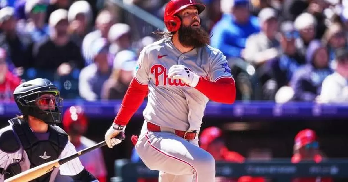 Marsh helps power 7-run first inning as Phillies beat Rockies 10-1 in Colorado’s home opener