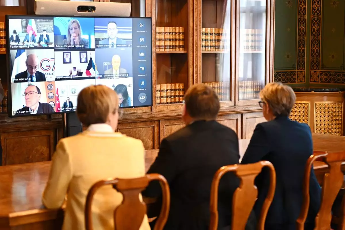 Britain's Foreign Secretary Yvette Cooper, right, attends a virtual summit at the Foreign &amp; Commonwealth Office in London, on Thursday April 2, 2026, with around 35 countries to discuss ways of reopening the Strait of Hormuz. (Leon Neal/Pool Photo via AP)