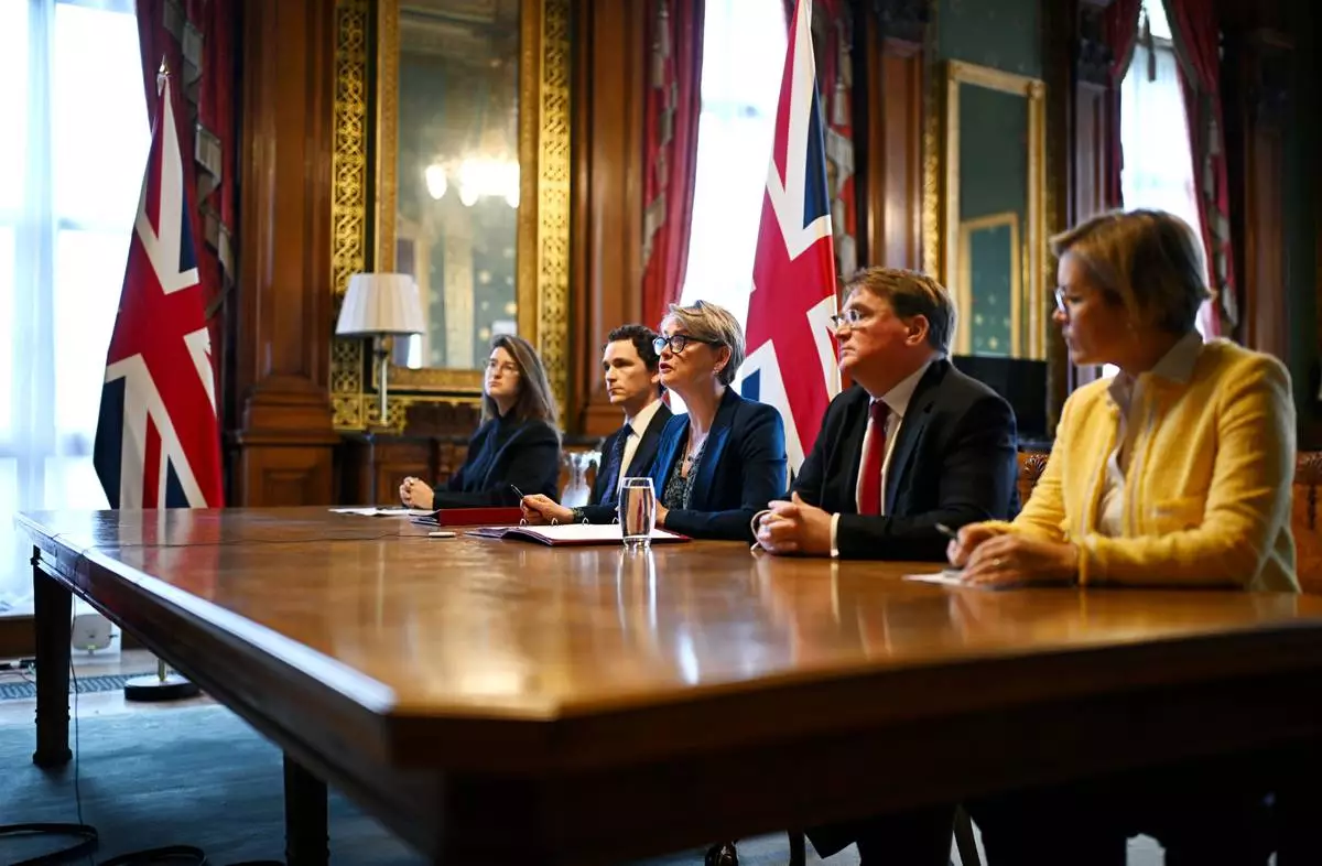 Britain's Foreign Secretary Yvette Cooper, center, speaks during a virtual summit at the Foreign &amp; Commonwealth Office in London, on Thursday April 2, 2026, with around 35 countries to discuss ways of reopening the Strait of Hormuz. (Leon Neal/Pool Photo via AP)